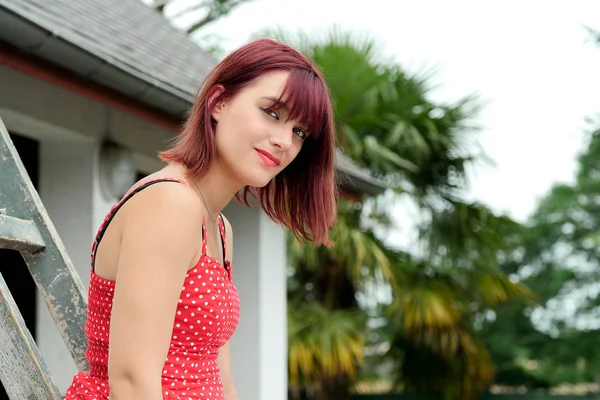 Portrait of a beautiful girl with red hair — Stock Photo, Image