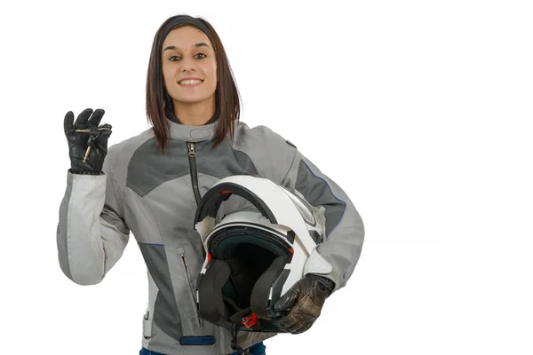 Ung kvinna visar stolt sin nya motorcykel licens på vit — Stockfoto