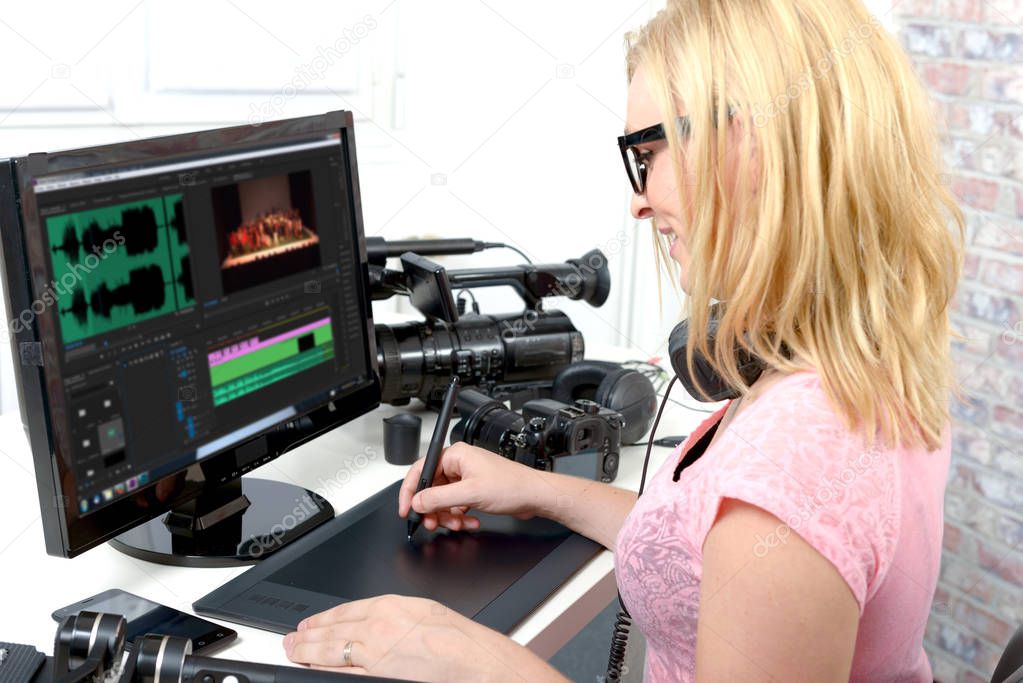 young woman designer using computer for the video editing