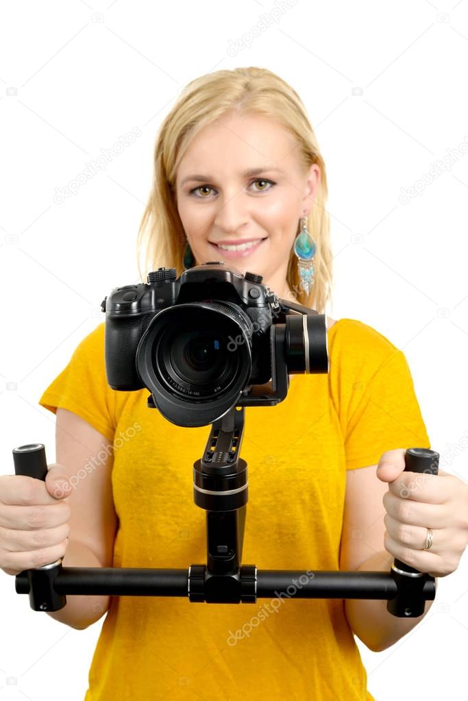 woman videographer using steady cam, on white