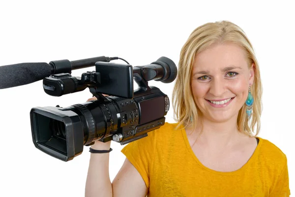 Jovem loira com filmadora de vídeo profissional, em branco — Fotografia de Stock