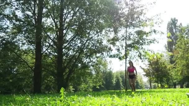 Beautiful young woman run in nature, slow motion — Stock Video