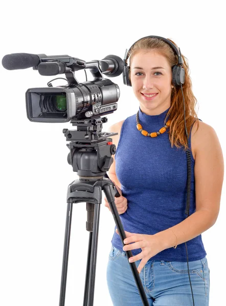 Jeune femme avec une caméra vidéo, sur fond blanc — Photo