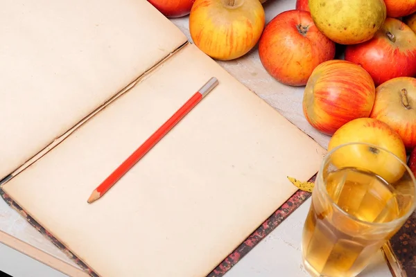 Red and yellow apples from Normandy with old  notebook — Stock Photo, Image