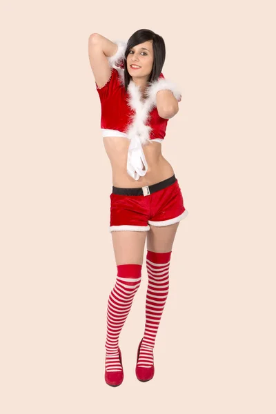 Mooie vrouw van de kerstman op de roze achtergrond — Stockfoto
