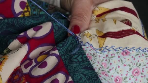Close up of woman's hand sewing patchwork — Stock Video