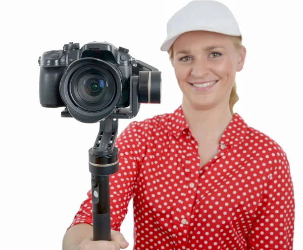 Young woman with dslr video stabilizer, on white — Stock Photo, Image