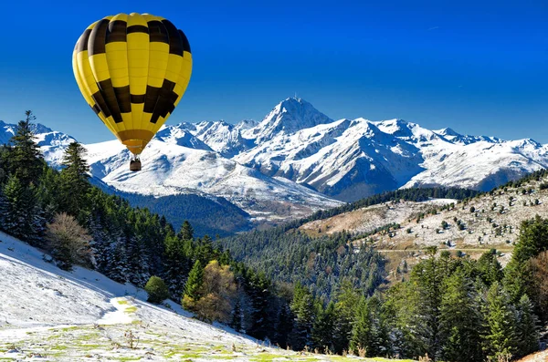 black and yellow hot air balloon with Pic du Midi de Bigorre  Py