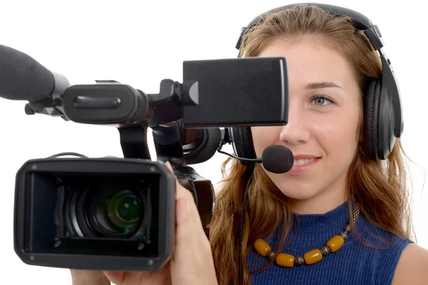 Mujer joven con una videocámara, sobre fondo blanco — Foto de Stock