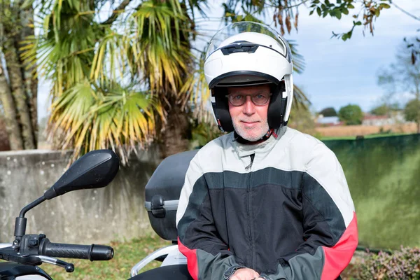 Portrait of a senior biker on his motorcycle — Stock Photo, Image