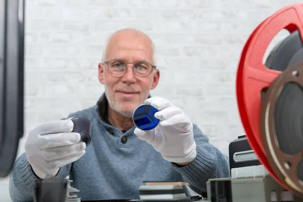 Technician digitalizing with white gloves negative film — Stock Photo, Image
