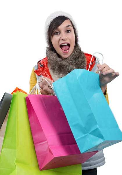 Młoda kobieta szczęśliwa z torby na zakupy, na białym — Zdjęcie stockowe