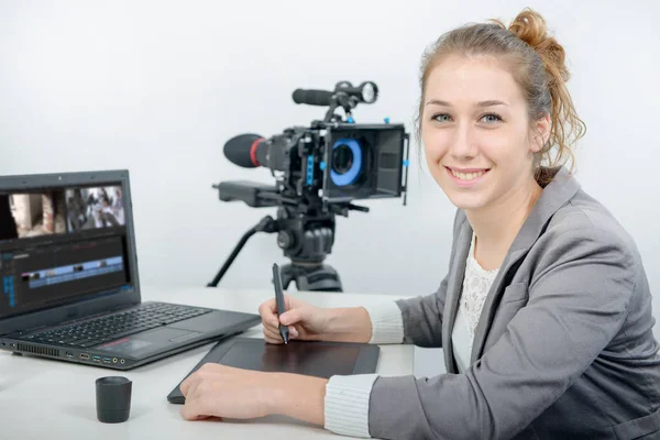 Young woman designer using graphics tablet for video editing — Stock Photo, Image