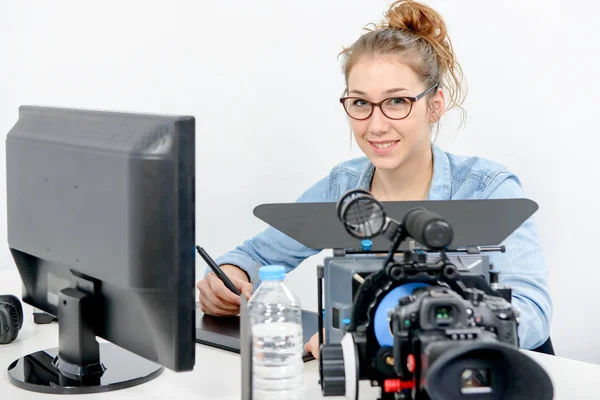 Young woman designer using graphics tablet for video editing — Stock Photo, Image