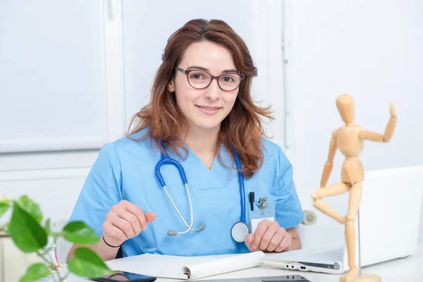 Portrait of young female doctor in his office — Stock Photo, Image