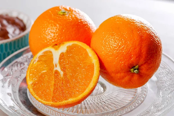 Close up of oranges in a glass dish — Stock Photo, Image