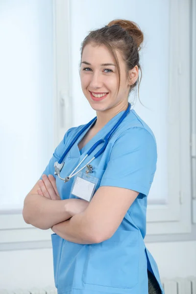 Portrait of young nurse in blue uniform — Stock Photo, Image