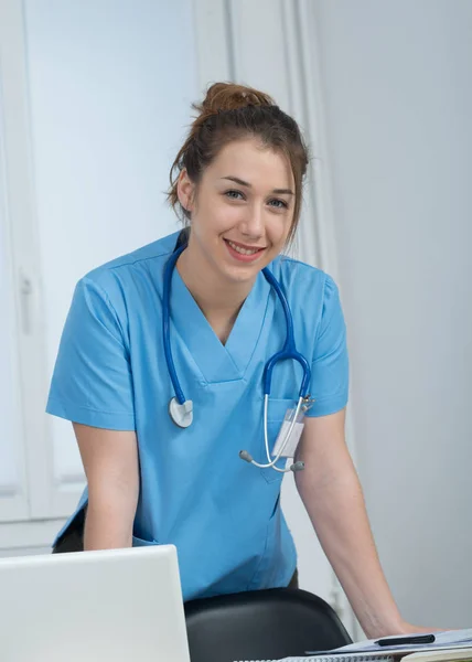 Portrait of young nurse in blue uniform — Stock Photo, Image