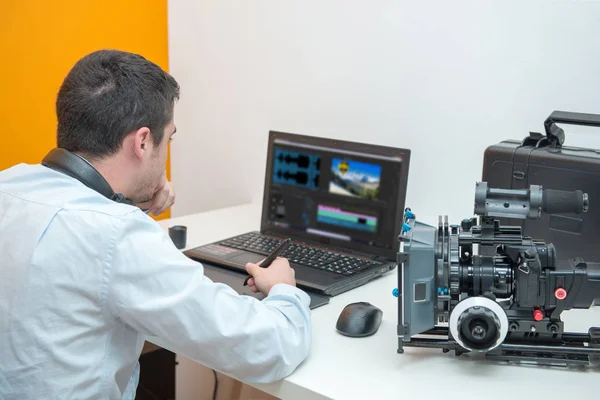 Young man designer using graphics tablet for video editing — Stock Photo, Image