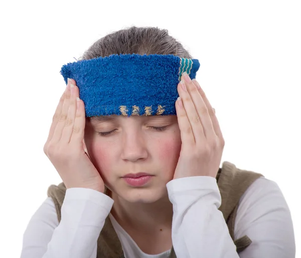 Jonge tiener heeft een hoofdpijn op witte achtergrond — Stockfoto