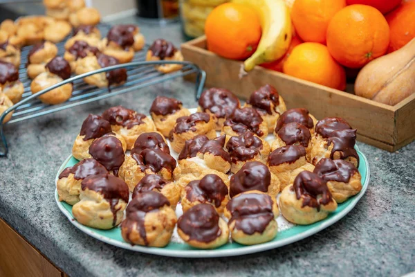 Chocolate Covered Vanilla Cream Pastry Puffs Closeup — Stock Photo, Image