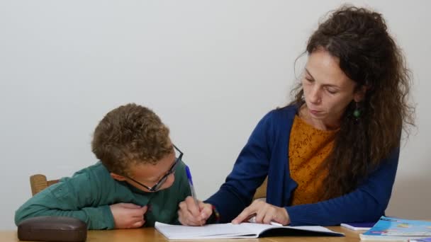 Little Boy Doing His Homework Mother — Stock Video