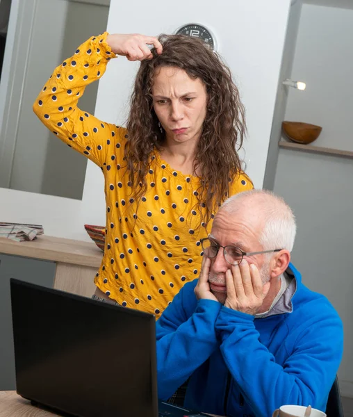 Young woman and senior man have problem with  laptop computer — Stock Fotó