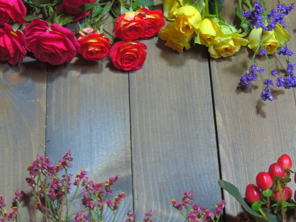 red flowers on a background of old wood.flowers with a blurred background.