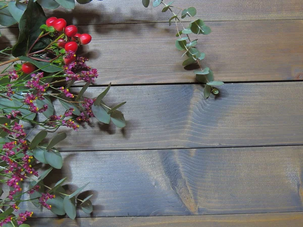 red flowers on a background of old wood.flowers with a blurred background.