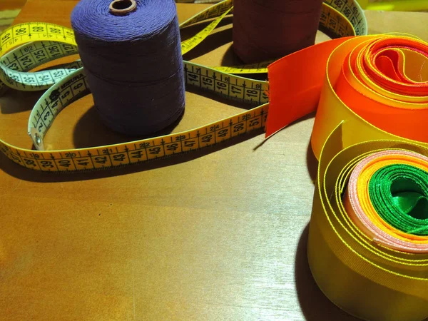 sewing thread and yellow measuring tape.set for cutting and sewing.