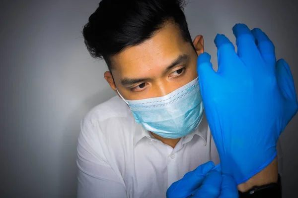 doctor wearing mask and gloves