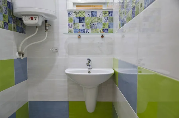 Real small bathroom in blue and green colors