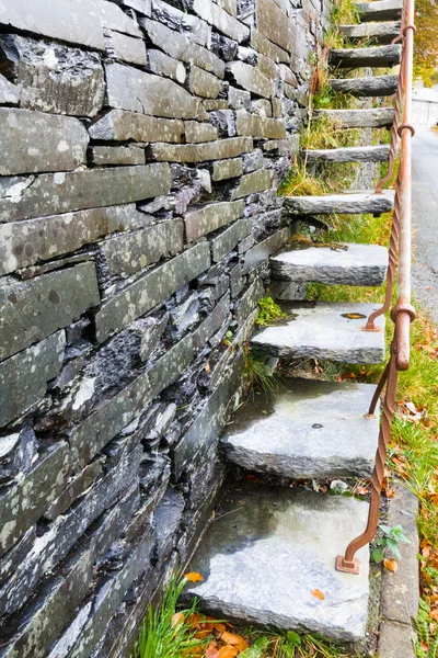 Cantilevered steps, slate  in wall — Stock Photo, Image