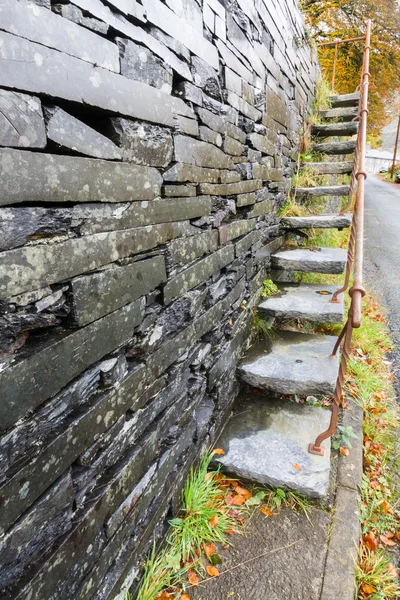 Cantilevered steps, slate  in wall — Stock Photo, Image