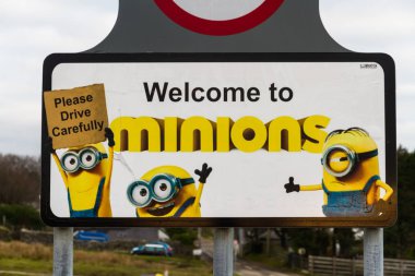 Sign for village of Minions, showing characters from movie. Bodm clipart