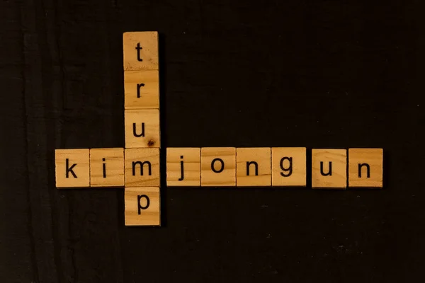 Trump and Kim Jong Un spelled on wooden blocks — Stock Photo, Image