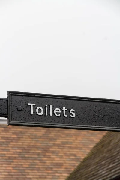 Vingerteken voor toiletten, landschap — Stockfoto