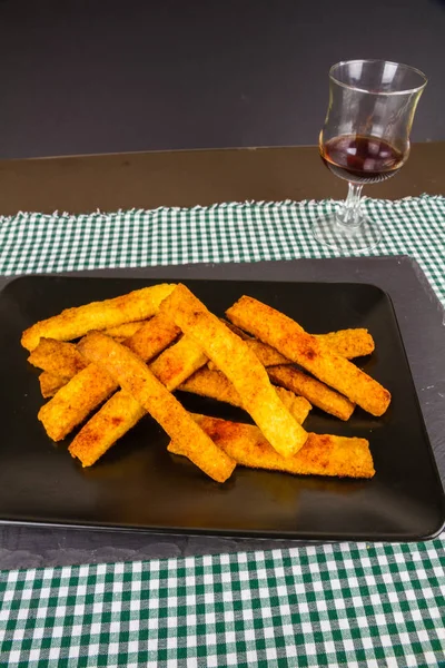 Home made cheese straws on plate on slate — Stock Photo, Image