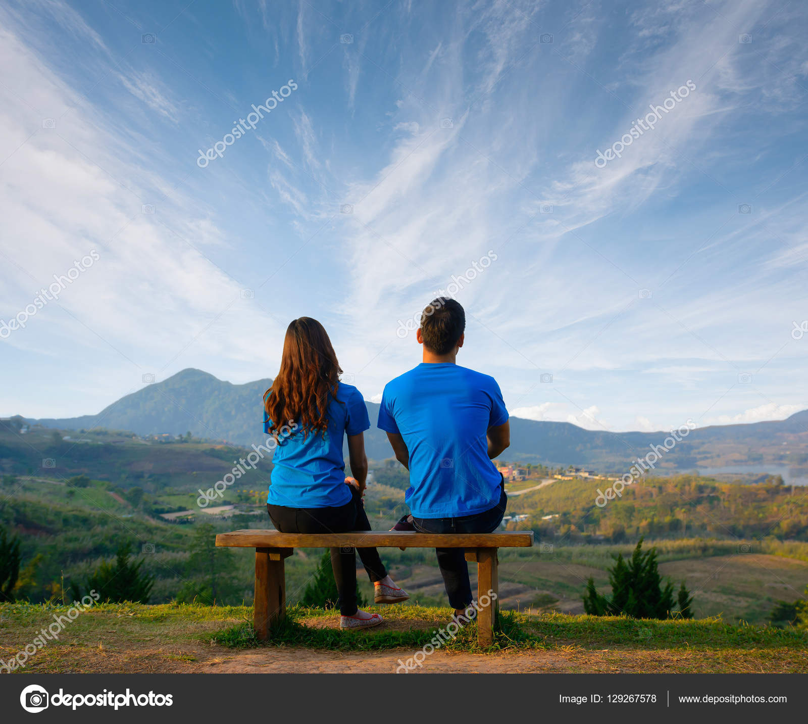 Scene of romantic and happy asian young romantic couple sitting and hugging  with natural background ; happy traveling concept, sweet lover concept.  Stock Photo by ©thatreec 129267578