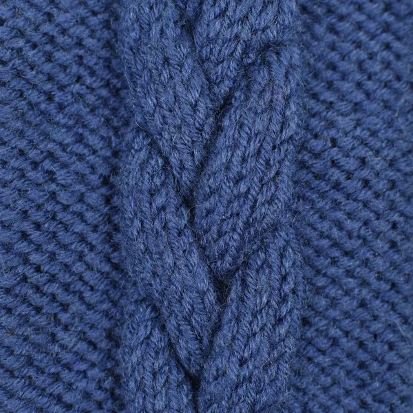 Рукоділля, хобі, в'язання. Тло текстильна тканина з в'язаною текстурою вовна синього кольору. В'язаний візерунок як фон . — стокове фото