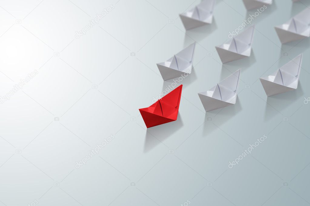 uniqueness concept, paper boat outstanding from the others
