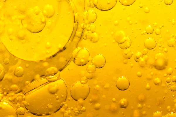 Golden bubble oil — Stock Photo, Image