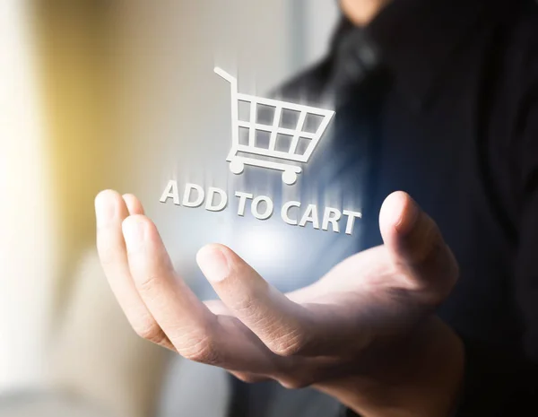 Business man doing online shopping with cart — стоковое фото