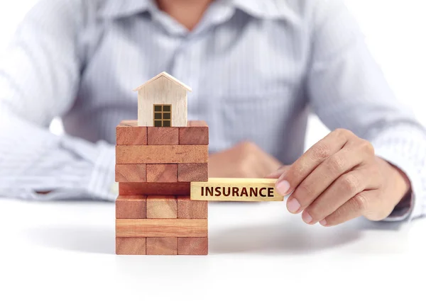 Home insurance concept, wooden model home — Stock Photo, Image