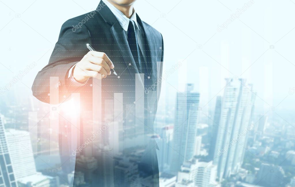 businessman present increasing graph with city background, business growth