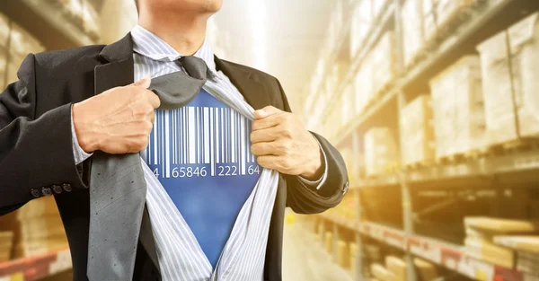 Businessman with barcode reader in warehouse, logistics — Stock Photo, Image