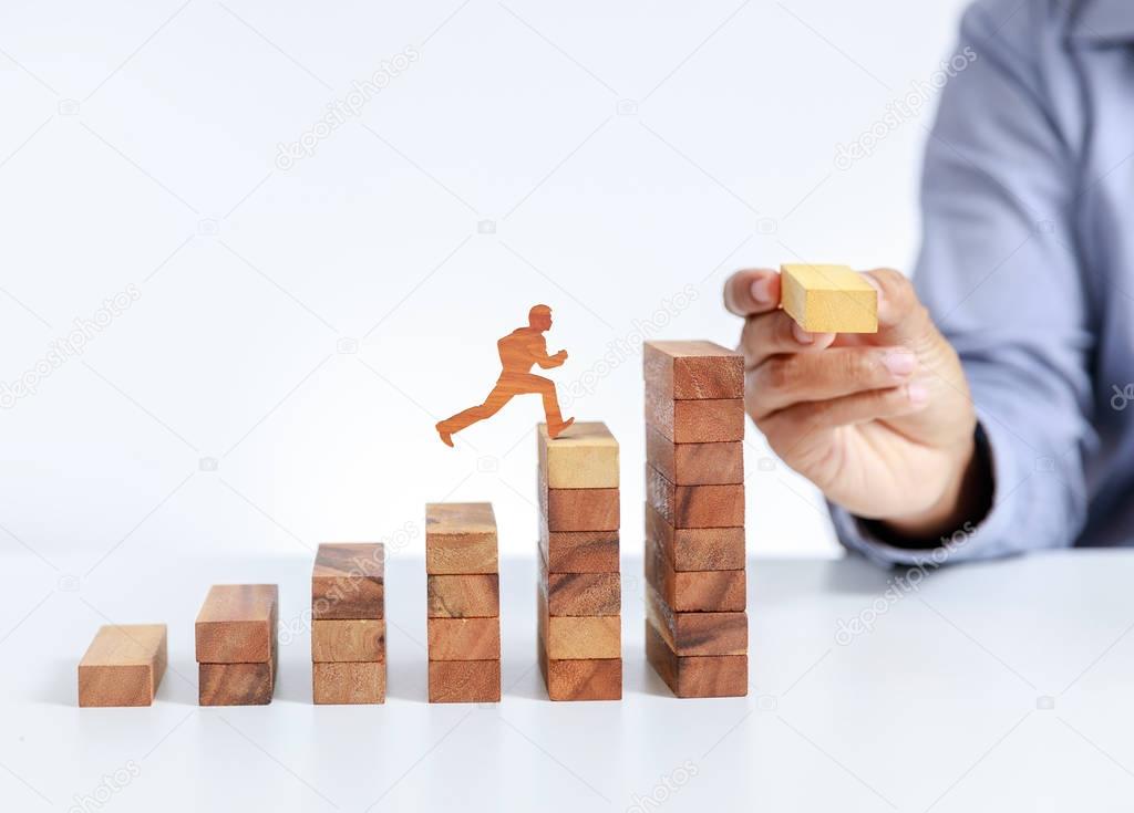 businessman climb up on stair to goal