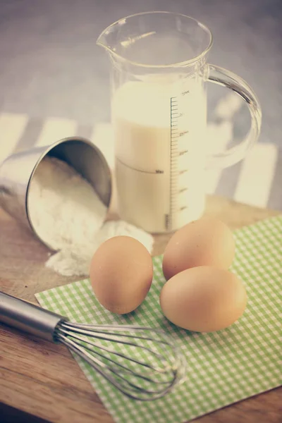 Ingredients for pastry on the table, egg flour