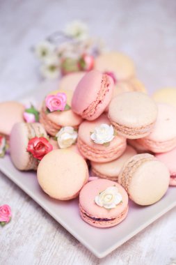 Fruit macaroons in a rustic, traditional style,wooden table, raspberry macaroons