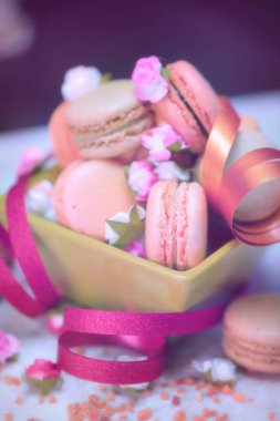 Fruit macaroons in a rustic, traditional style,wooden table, raspberry macaroons